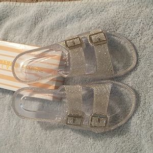 Two strap **CLEAR** slides with rhinestones